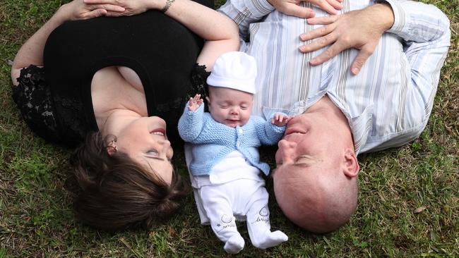 Lucinda and Damon Simpson with their little miracle, Angus. Photographer: Liam Kidston.