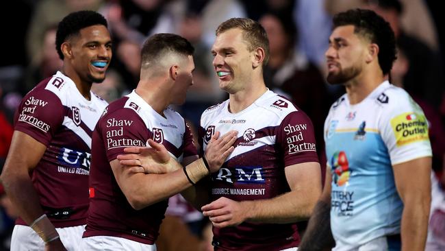 SYDNEY, AUSTRALIA - JULY 21: Tom Trbojevic of the Sea Eagles celebrates with team mate Reuben Garrick after scoring a try during the round 20 NRL match between Manly Sea Eagles and Gold Coast Titans at 4 Pines Park, on July 21, 2024, in Sydney, Australia. (Photo by Brendon Thorne/Getty Images)