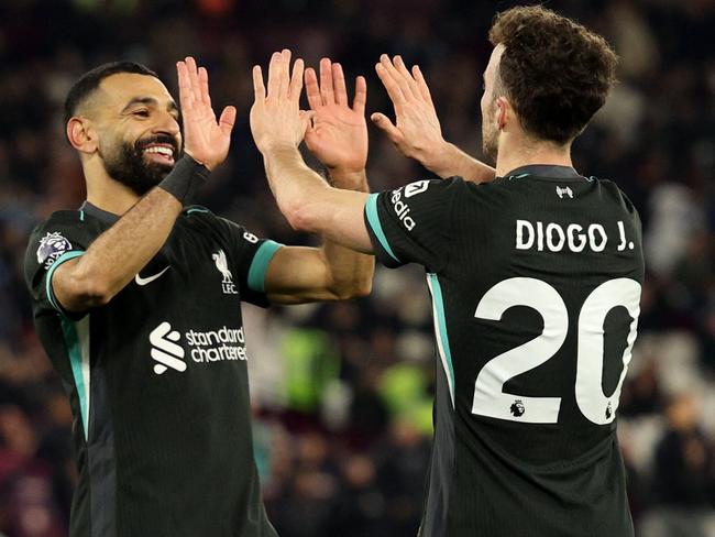 Diogo Jota celebrates scoring Liverpool's fifth goal with Mohamed Salah. Picture: AFP