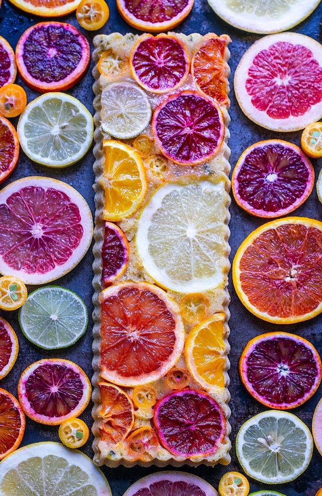 In Germany, February is the ultimate month for citrus fruit. Inspired by a weekly delivery of organic produce, the photographer created a rectangular cake with spelt flour, adorned with an array of colourful citrus fruits: lemon, lime, grapefruit, cumquat, clementine, orange, blood orange, and pink orange. Picture: Carolin Strothe and Sebastian Keitel/Pink Lady® Food Photographer of the Year