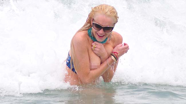 Lindsay Lohan suffers embarrassing nip-slip after THAT beach spat