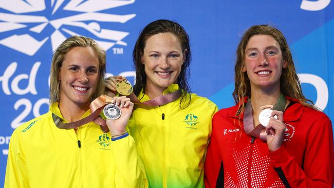 Bronte and Cate Campbell with Taylor Ruck of Canada during the medal ceremony for the women's 50m freestyle final. Picture: Clive Rose/Getty Images