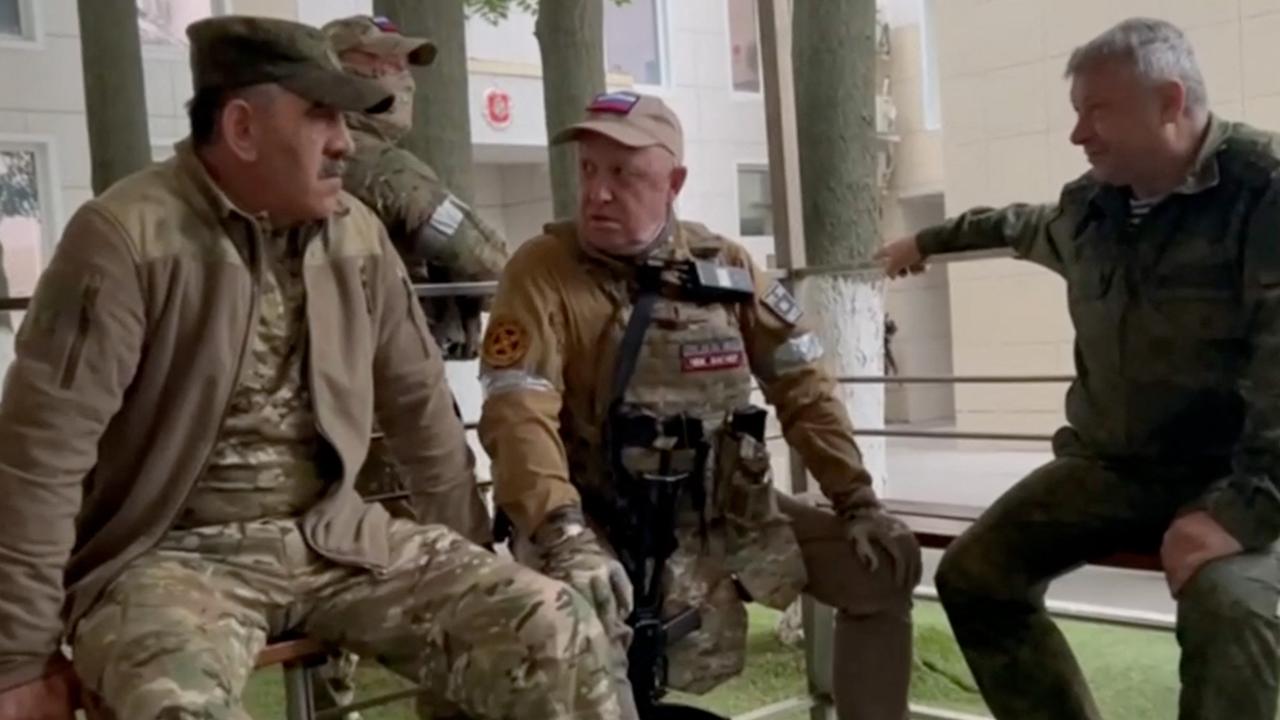 Yevgeny Prigozhin (centre) speaks with Lieutenant General Vladimir Alekseev (right) and Russian Defence Deputy Minister Yunus-Bek Evkurov inside the headquarters of the Russian southern military district in the city of Rostov-on-Don. Picture: AFP