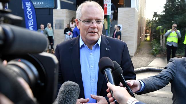 Scott Morrison speaks to the media as they arrive at church. Picture: AAP