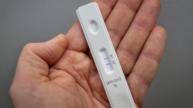 A sore throat is the most common first symptom before a positive test. Picture: Odd ANDERSEN / AFP