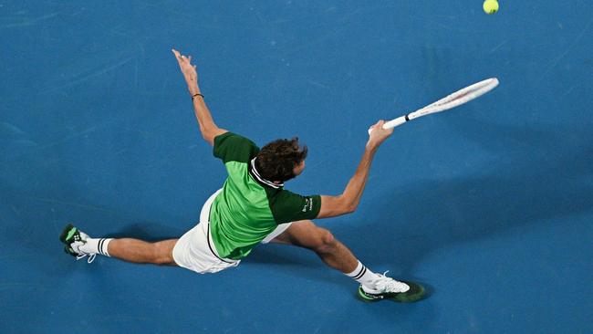 Russia's Daniil Medvedev hits a return against Germany's Alexander Zverev during their men's singles semi-final. Picture: Anthony Wallace / AAP.