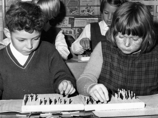 Prospect school year 3 students learn their times tables with peg boards in 1966.