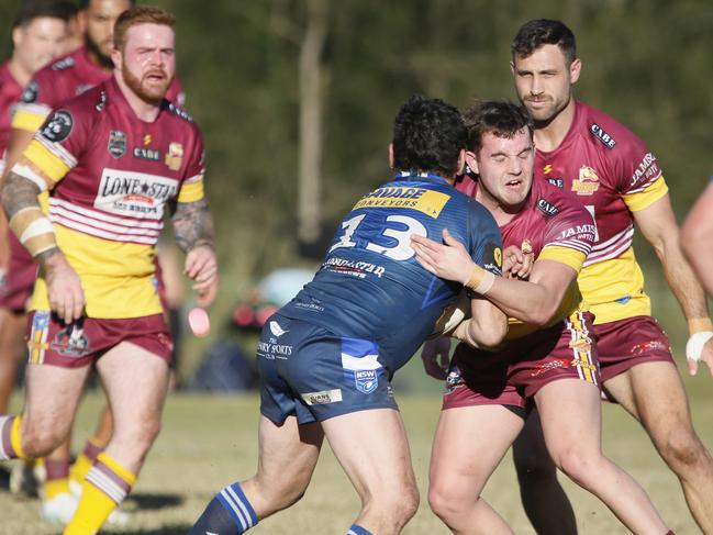 John Hanson is tackled. Picture Warren Gannon Photography