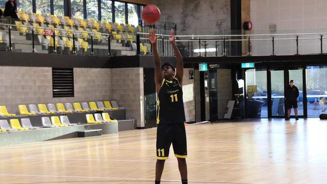 St Laurence's College’s Nithesh Thayabaran - #11 Shooting a free throw.