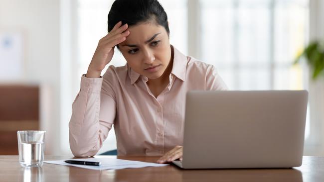 Unhappy young woman frustrated with virus or scam, investment, bills generic sad