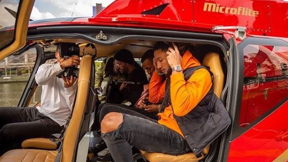 Simmons aboard a Microflite helicopter. Picture: Instagram @microflite