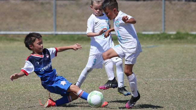 Action from Carrara on day two of the Premier Invitational junior football tournament. Picture: Mike Batterham