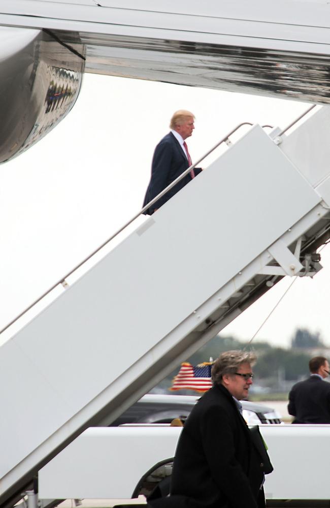 Better days on Air Force One for Donald Trump and Steve Bannon. Picture: AFP/Nicholas Kamm