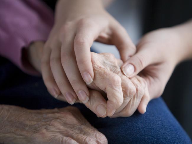 Aged persons hands held by young hands. Pic is Istock image. One time use only.