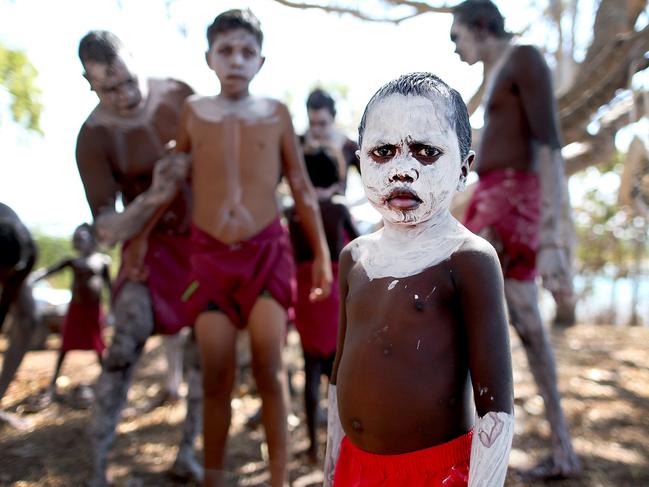 NEWS_People from the Rirratjingu Tribe in Yirrkala in East Arnhem Land in Northern Territory prepare themselves for a welcome to country for the australian PM this afternoon Sunday September 14th, 2014. Pictures: Jack Tran / The Courier Mail