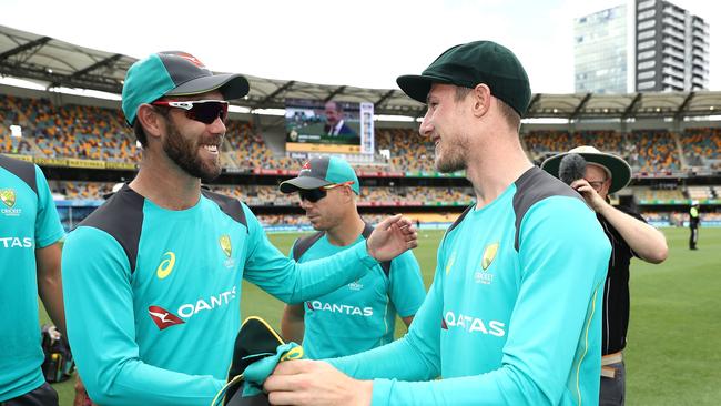 Cameron Bancroft congratulated by Glenn Maxwell after he was presented with his Baggy Green Cap. Picture: Getty Images.