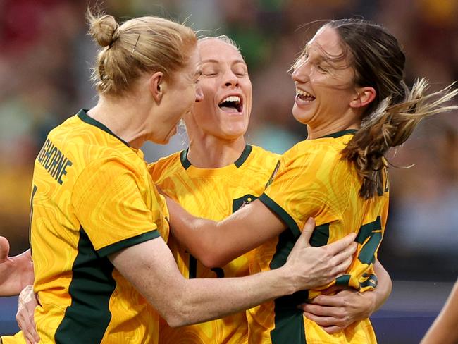 Leah Davidson of the Matildas celebrates her first international goal with teammates Clare Polkinghorne and Tameka Yallop during the International Friendly Match between the Australia Matildas and Chinese Taipei. Photo by Jonathan DiMaggio/Getty Images.