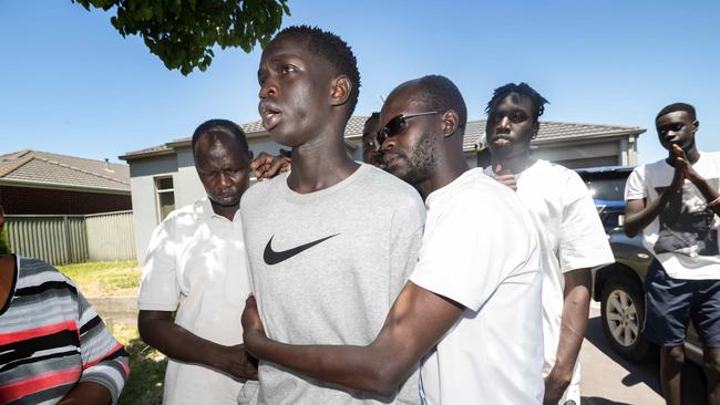 Sebit Abraham Tit is comforted as he recounts the horror events that lead to his cousin drowning. Picture: Tony Gough