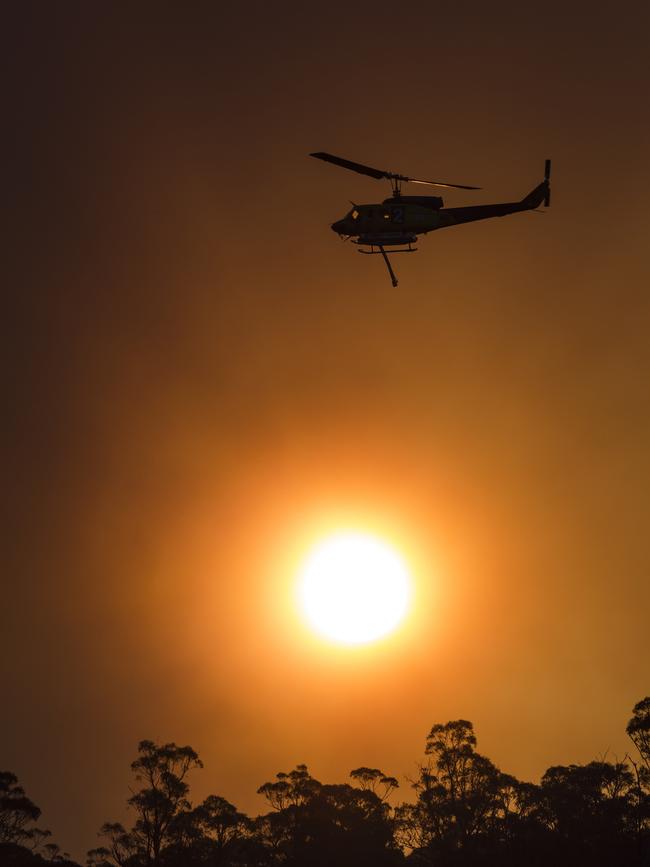 A helicopter at work in Miena in Tasmania’s Central Plateau. Picture: HEATH HOLDEN/Getty Images