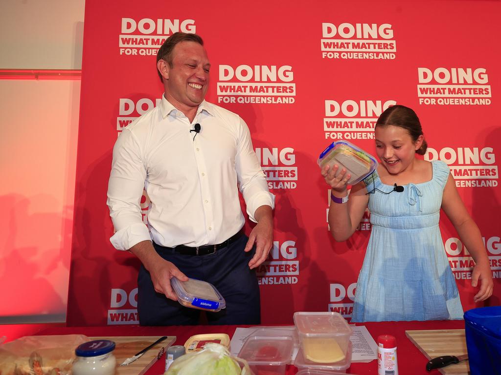 Premier Steven Miles makes a sandwich with his daughter Bridie, 10, on stage as part of the launch. Picture: Adam Head