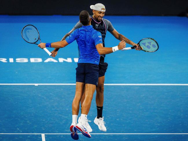 Nick Kyrgios and Novak Djokovic celebrate their victory. Picture: Patrick Hamilton/AFP