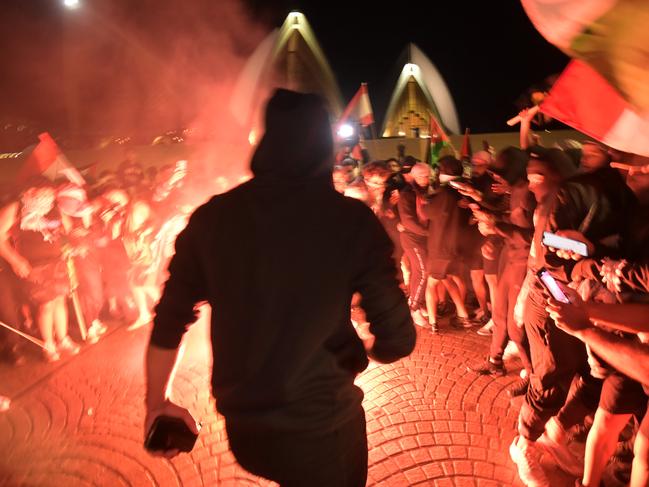 Flares light up the pro-Palestine protest. Picture: NCA NewsWire / Jeremy Piper