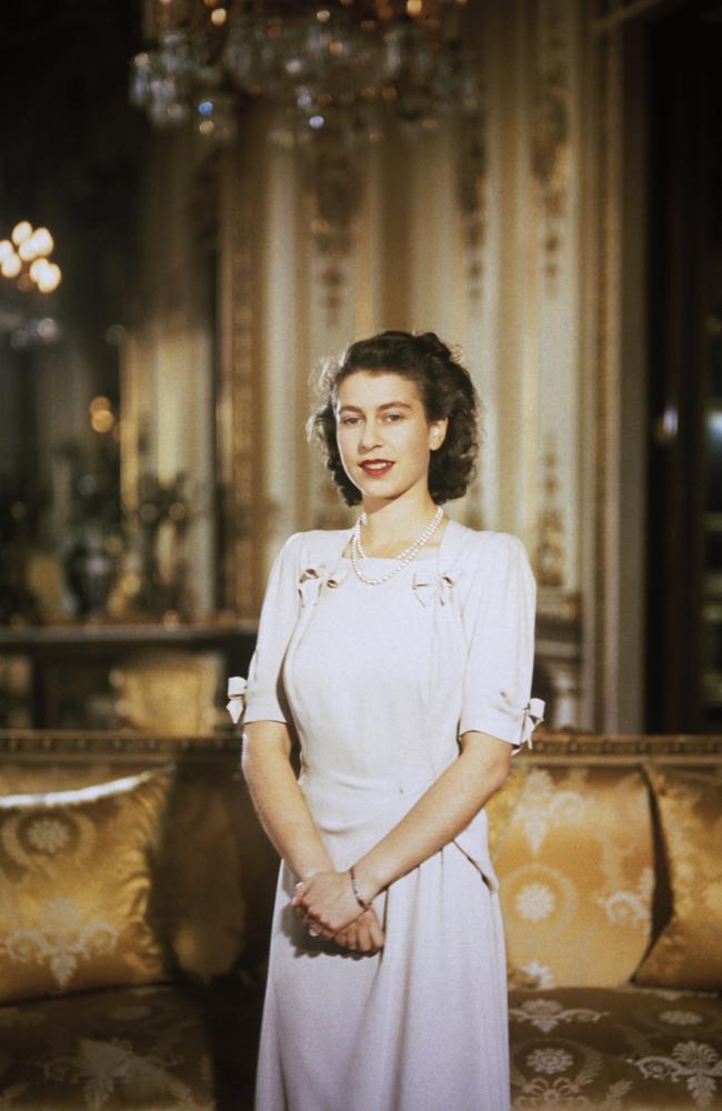 Princess Elizabeth, the future Queen Elizabeth II, in the state apartments at Buckingham Palace during her engagement to Prince Philip. Picture: Hulton Archive/Getty Images