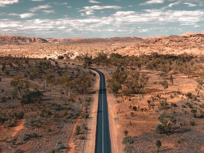 Driving on the roads surrounding Alice Springs.A thriving, spirited outback centre, Alice Springs is as famous for the personality of its locals and contemporary and traditional art as the natural wonders, including the stunning Larapinta Trail and the MacDonnell Ranges, which surround it.credit: David Andersonescape24 february 2021doc holiday