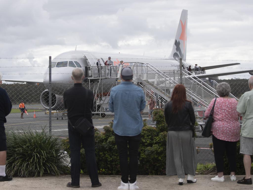 Friends and families watch on as a Jetstar flight lands at the Ballina-Byron Gateway Airport in Byron Bay. Pocture: Brook Mitchell