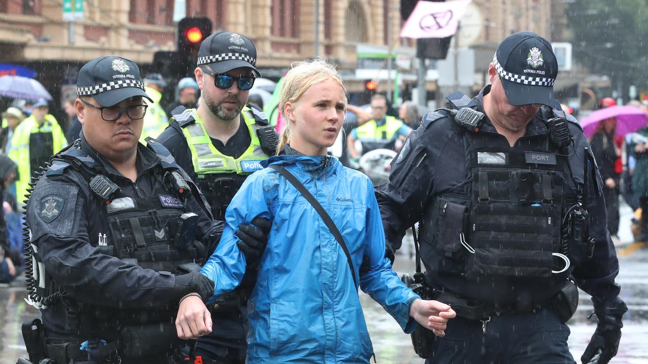 Seventy-two people were arrested after they sat on the road at the intersection of Flinders and Swanson Streets. Picture: NCA NewsWire / David Crosling