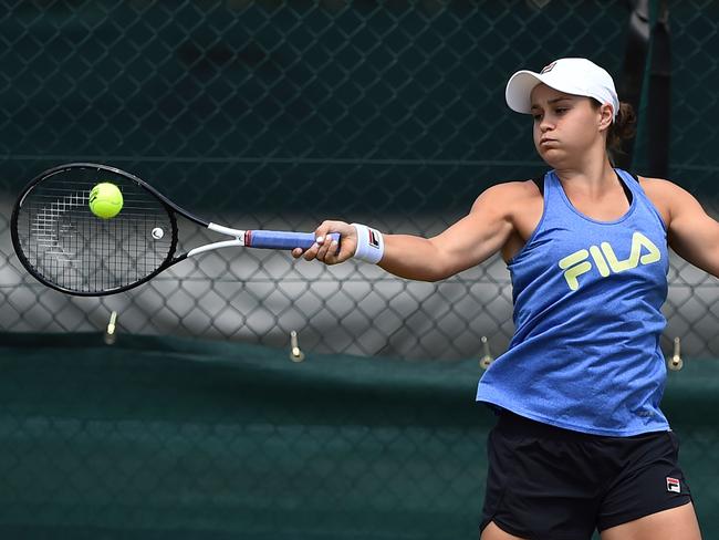 Australia's Ashleigh Barty hits a forehand at the practice courts at The All England Tennis Club in Wimbledon, southwest London, on June 30, 2019, on the eve of the start of the 2019 Wimbledon Championships tennis tournament. (Photo by Glyn KIRK / AFP) / RESTRICTED TO EDITORIAL USE