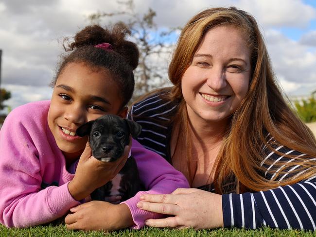 Riverlea residents Chloe and her daughter Lilly with their new puppy Leah. Picture: Supplied