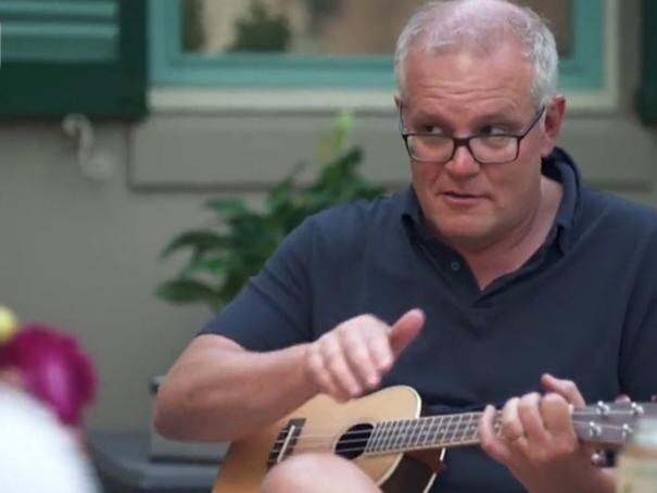 Scott Morrison playing a ukulele during a 60 Minutes interview.