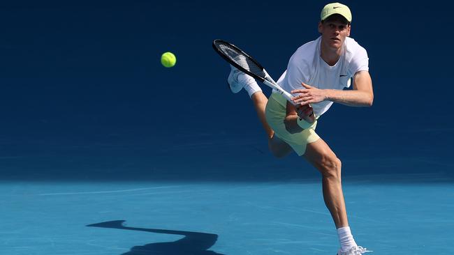 Jannik Sinner plays a backhand against Nicolas Jarry in during his opening victory