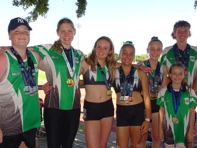 Medal-winning Ipswich and District Athletic Club competitors Sebastien Sills, Charlize Goody, Isabella Willshire, Addison Farinazzo, Acacia Wohlsen, Minaya Wohlsen and Ethan Platen in Townsville. Picture: Vic Pascoe