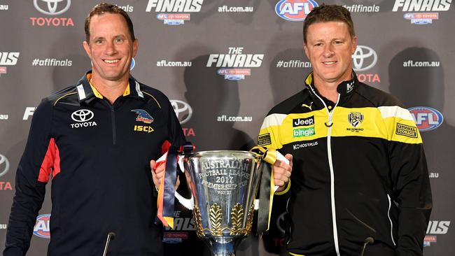 Adelaide coach Don Pyke and Richmond coach Damien Hardwick pose with the AFL premiership trophy before this year’s grand final. Picture: AAP