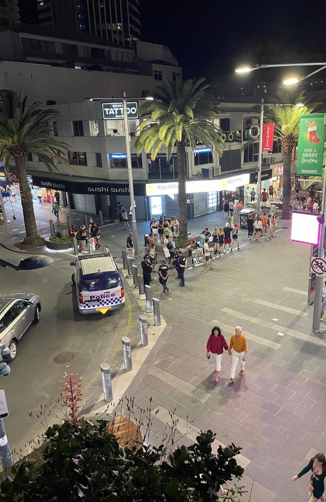 Police, tourists and schoolies fill the precinct.