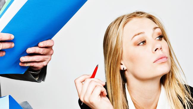 A bored and rebellious young businesswoman pointedly ignores her boss and the work he's trying to hand over to her to add to the already large stack of pending work. She has had enough!