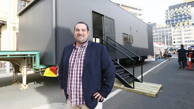 A homelessness expo is held at City Hall today. Josh Muscett of Podmatrix is pictured with his stackable solution to the crisis - a moveable, cheap and disability friendly house (or pod). Picture: MATT THOMPSON