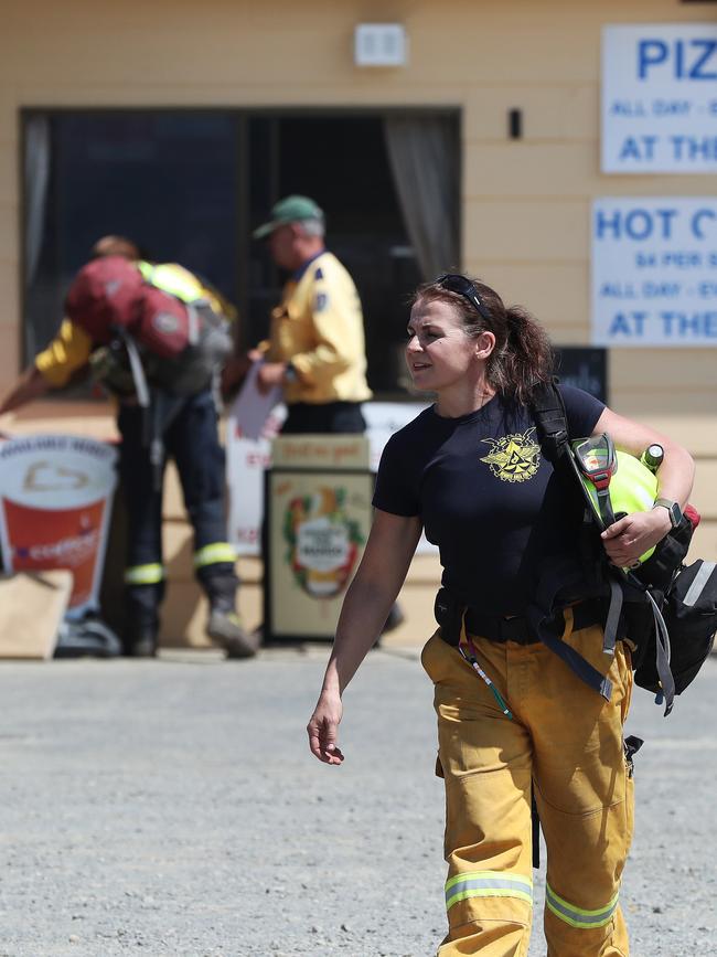 Personnel from the ACT Rural Fire Service head out from The Great Lakes store to the fire front near Miena. Picture: LUKE BOWDEN