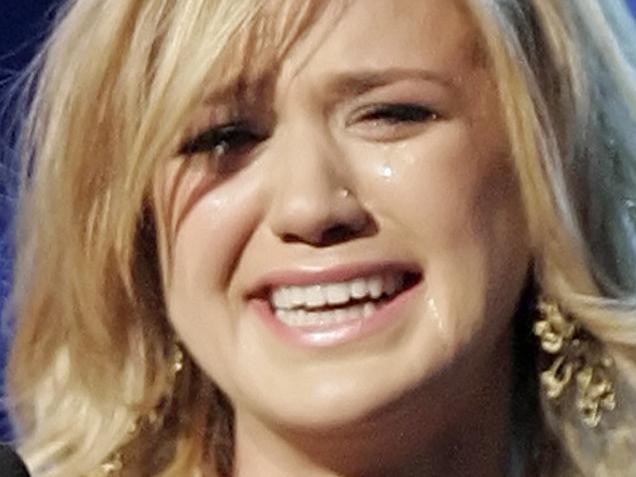 Kelly Clarkson accepts the award for best female pop vocal performance for "Since U Been Gone" at the 48th Annual Grammy Awards on Wednesday, Feb. 8, 2006, at the Staples Center in Los Angeles. (AP Photo/Mark J. Terrill)