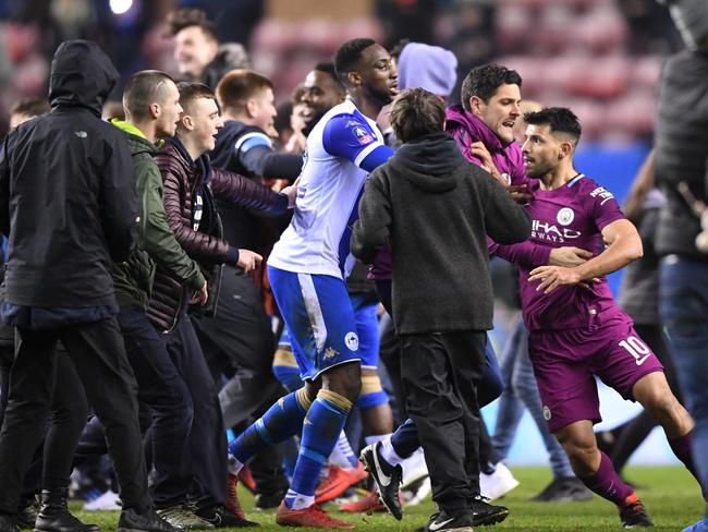 Sergio Aguero of Manchester City is surrounded by fans.