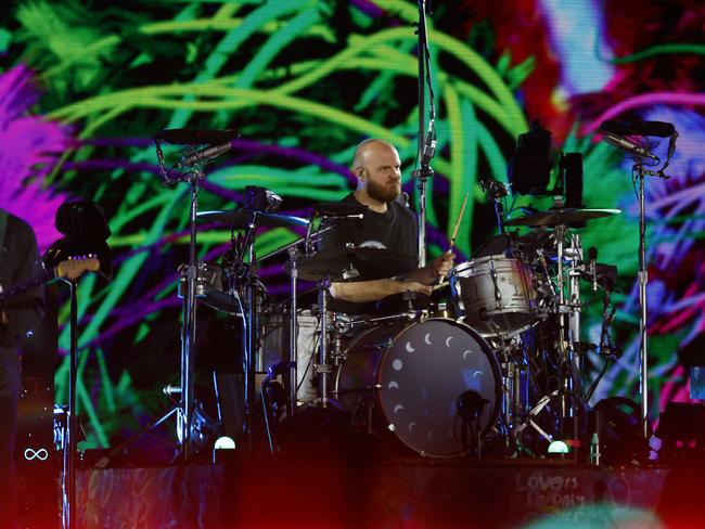 Will Champion from Coldplay on stage at Accor Stadium. Picture: Jonathan Ng