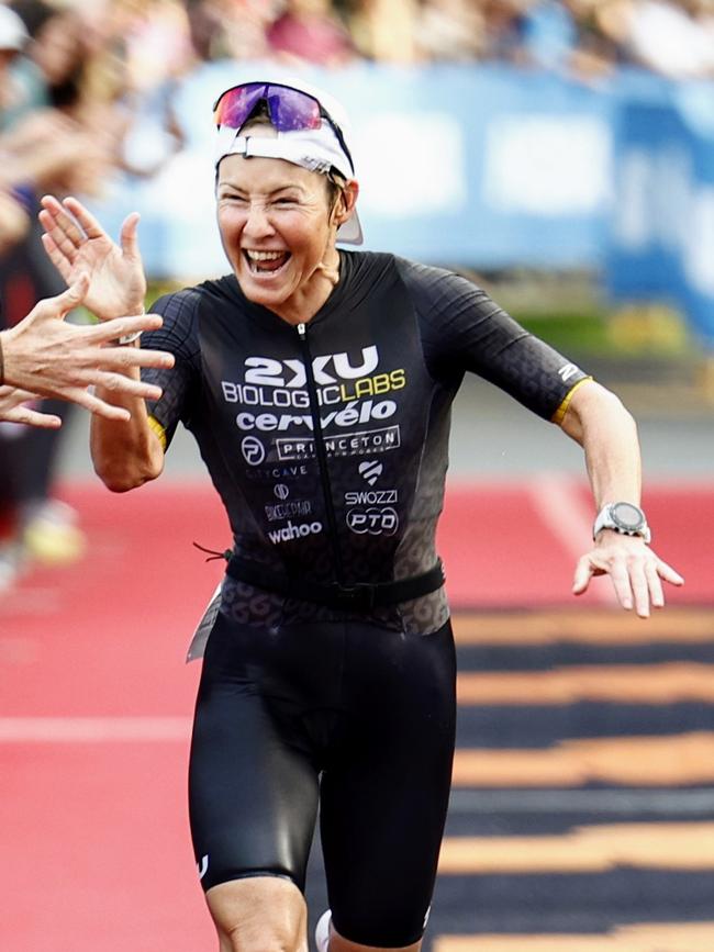 Kylie Simpson crosses the finish line on the Cairns Esplanade to win the Ironman Cairns Asia Pacific Championship race. Picture: Brendan Radke