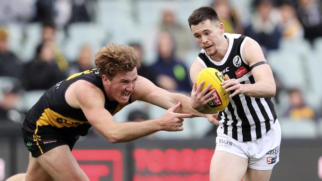 Glenelg’s Will Gould chases Port Adelaide’s Sam Davidson during the SANFL second semi-final. Picture SARAH REED