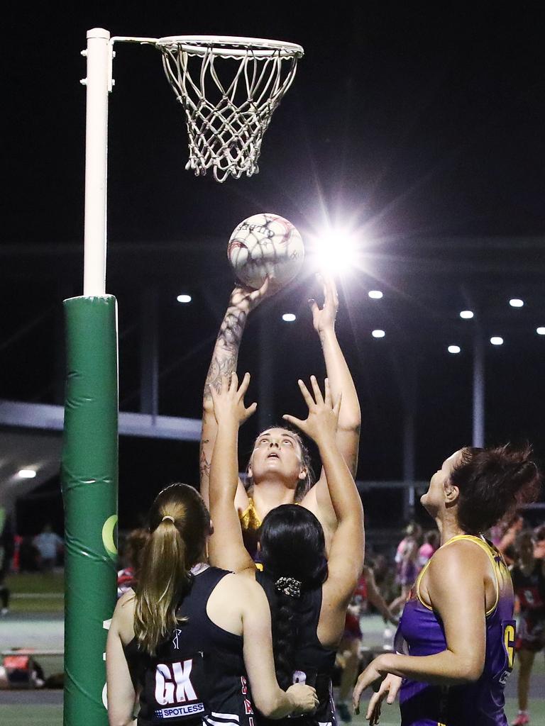 Fierce's Cayla George towers over the Saints players in the Cairns Netball Association Senior Division 1 match between the Phoenix Fierce and the Cairns Saints. PICTURE: BRENDAN RADKE