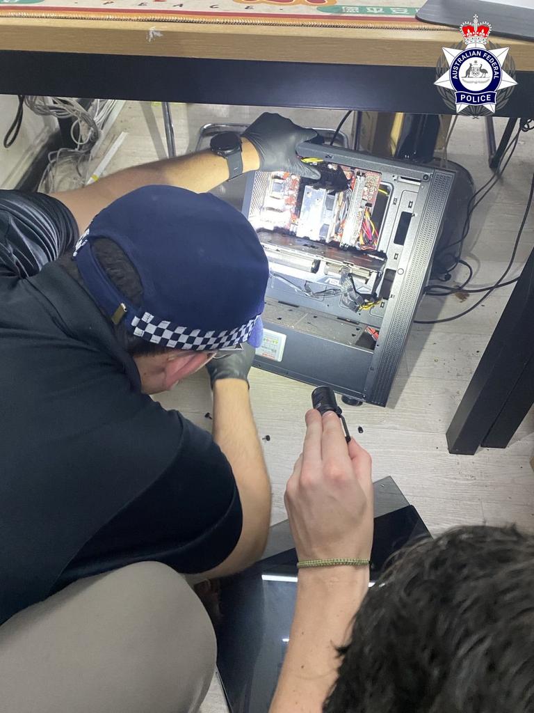 AFP officers search a compound in Manila, The Philippines over a significant suspected scam.