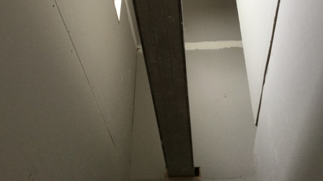 A beam with no support and no safety for falls in the townhouse at a worksite in Preston. Source: VBA