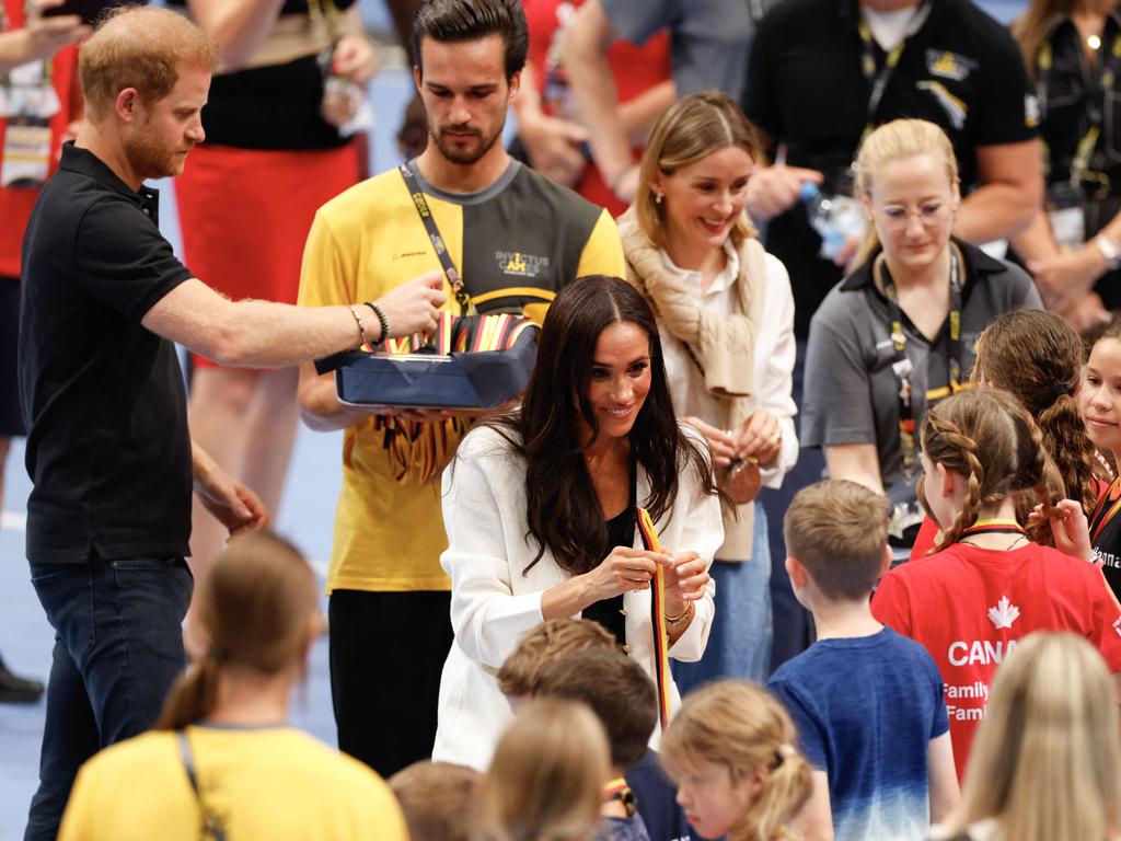 The Duke and Duchess then got into the spirit of the games as they waved their hands from side to side along with the raucous crowd.