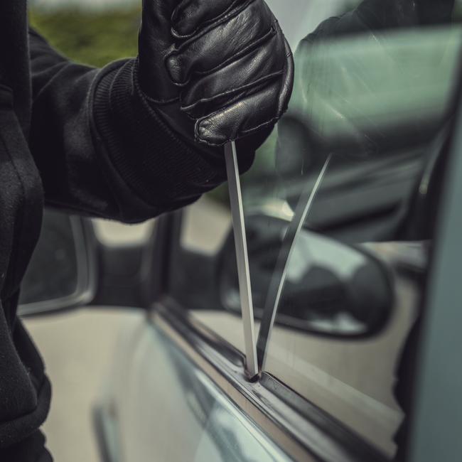 Thief opening a car's door. Picture: Supplied